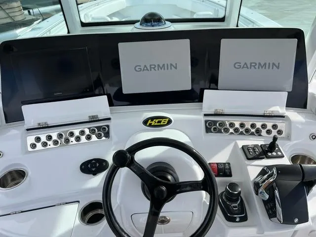 Slide: The Image of 2023 HCB 39 Speciale boat dashboard with Garmin navigation systems. - 12