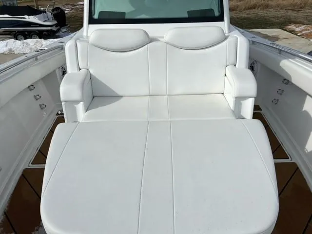 Slide: The Image of 2023 HCB 39 Speciale boat with white cushioned seating. - 13