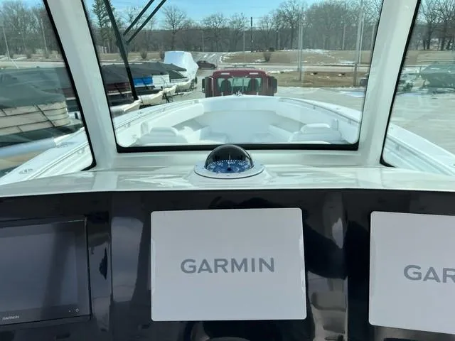 Slide: The Image of 2023 HCB 39 Speciale boat dashboard with Garmin navigation system. - 5