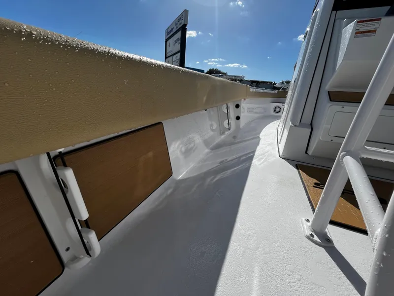 Slide: The Image of 2024 Sportsman Masters 247OE Bay Boat deck under sunny sky. - 11