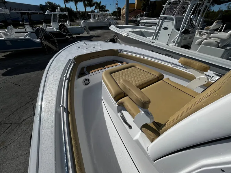 Slide: The Image of 2024 Sportsman Masters 247OE Bay Boat with tan seating and white deck. - 13