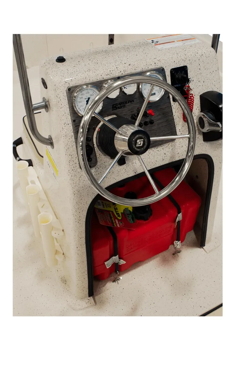 Slide: The Image of 2024 Carolina Skiff e21 DLX boat console with steering wheel and gauges. - 8