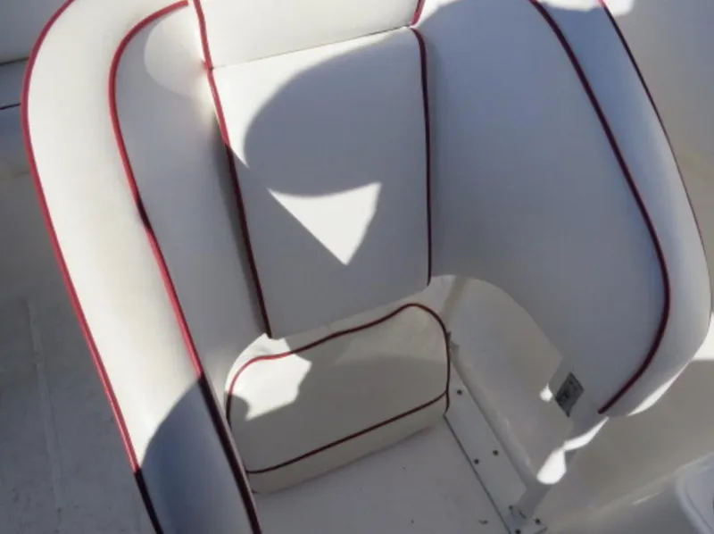 Slide: The Image of White boat seat with red trim on a 2007 Challenger DDC 33. - 12