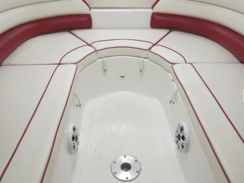 Slide: The Image of Interior seating of a 2007 Challenger DDC 33 boat with red and white upholstery. - 15