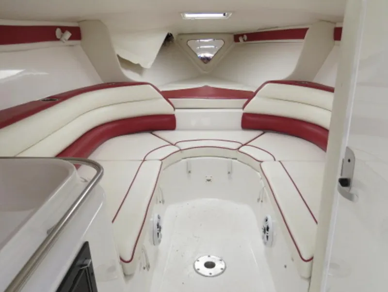 Slide: The Image of Interior of 2007 Challenger DDC 33 boat with white and red seating. - 17
