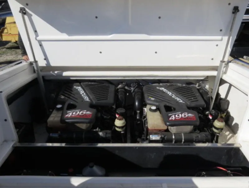 Slide: The Image of 2007 Challenger DDC 33 boat engine compartment with twin Mercury 496 MAG engines. - 8