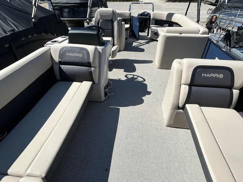 Slide: The Image of 2024 Harris Cruiser 230 pontoon boat interior with spacious seating and modern design. - 8