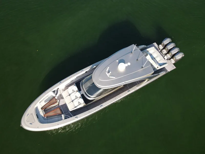 Slide: The Image of Aerial view of 2024 Mystic Powerboats M5200 on the water. - 10