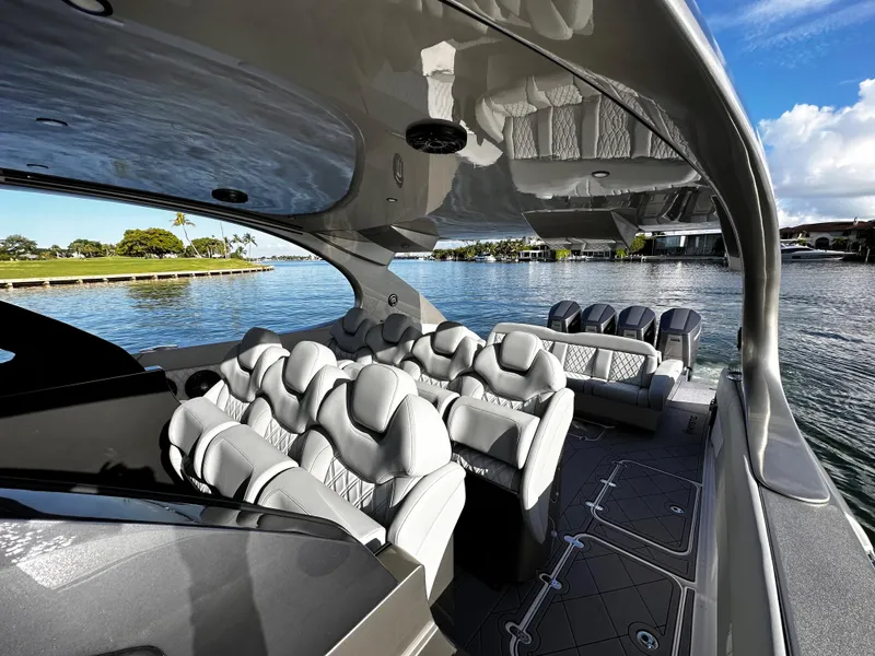 Slide: The Image of Interior of 2024 Mystic Powerboats M5200 with luxurious seating. - 2