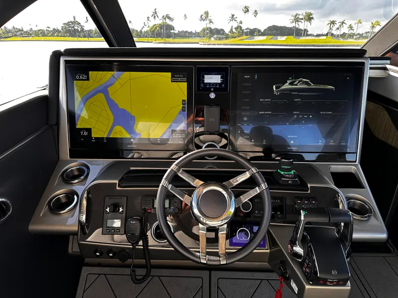 Slide: The Image of 2024 Mystic Powerboats M5200 cockpit with advanced navigation systems. - 3