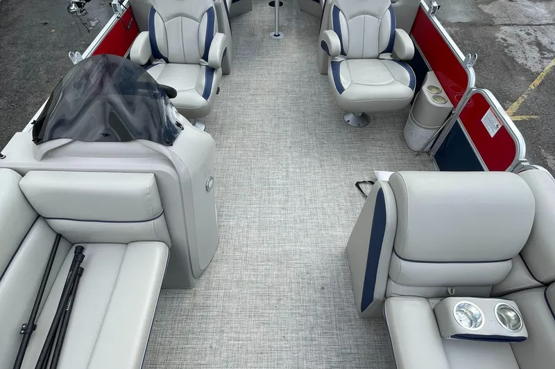 Slide: The Image of 2022 Berkshire 24RFXLE25 pontoon boat interior with plush seating and modern design. - 5
