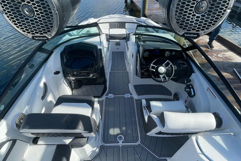 Slide: The Image of 2024 Monterey M4 boat interior with modern seating and advanced dashboard. - 2