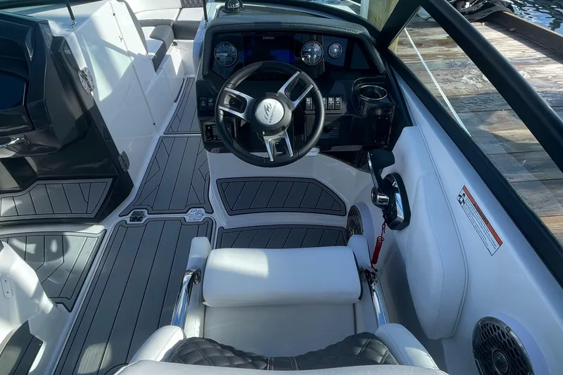 Slide: The Image of 2024 Monterey M4 boat cockpit with modern steering wheel and dashboard. - 3