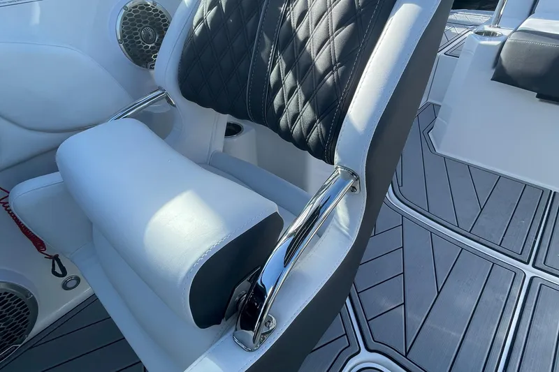 Slide: The Image of 2024 Monterey M4 boat interior with black and white seating and chrome accents. - 5