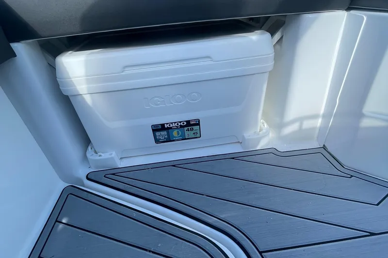 Slide: The Image of White Igloo cooler on 2024 Monterey M4 boat with gray deck flooring. - 7