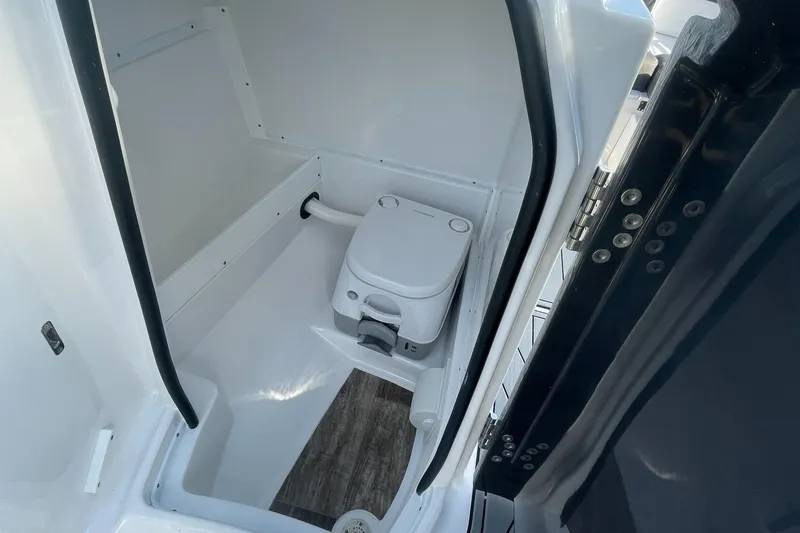 Slide: The Image of 2024 Monterey M4 boat interior bathroom with compact toilet. - 8