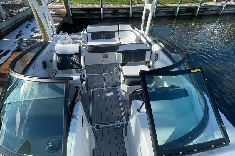 Slide: The Image of 2024 Monterey M4 boat interior with seating and open windshield. - 9
