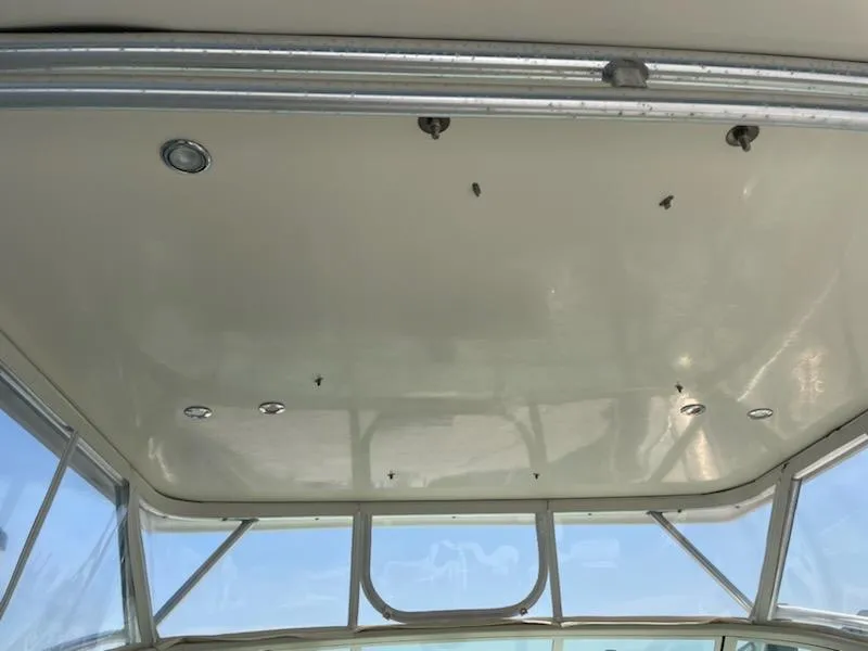 Slide: The Image of 2008 Albemarle 31 boat interior ceiling with lights and windows. - 12