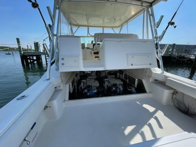 Slide: The Image of 2008 Albemarle 31 boat with open engine compartment, docked at marina. - 27