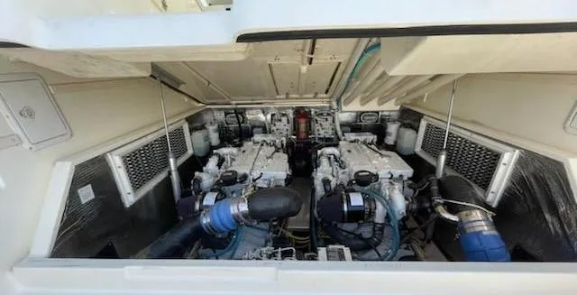 Slide: The Image of Engine compartment of a 2008 Albemarle 31 boat, showcasing dual engines and mechanical components. - 29
