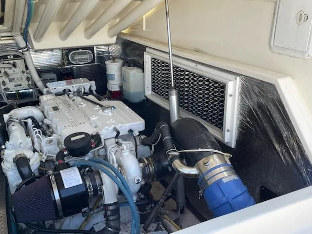 Slide: The Image of Engine compartment of a 2008 Albemarle 31 boat, showcasing mechanical components and ventilation. - 31