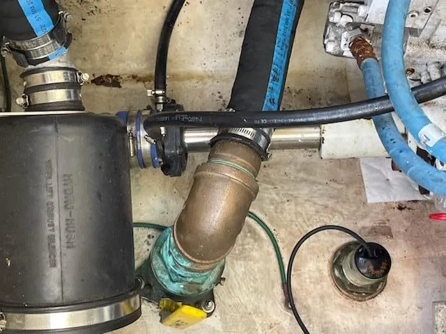 Slide: The Image of Engine compartment of a 2008 Albemarle 31 boat showing hoses and fittings. - 32