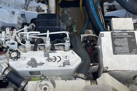 Slide: The Image of Engine compartment of a 2008 Albemarle 31 boat, showing mechanical components and hoses. - 33