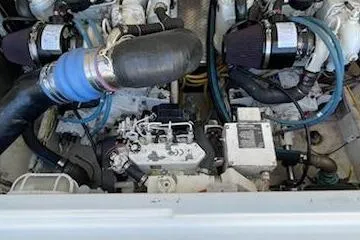 Slide: The Image of Engine compartment of a 2008 Albemarle 31 boat, showcasing mechanical components and hoses. - 34
