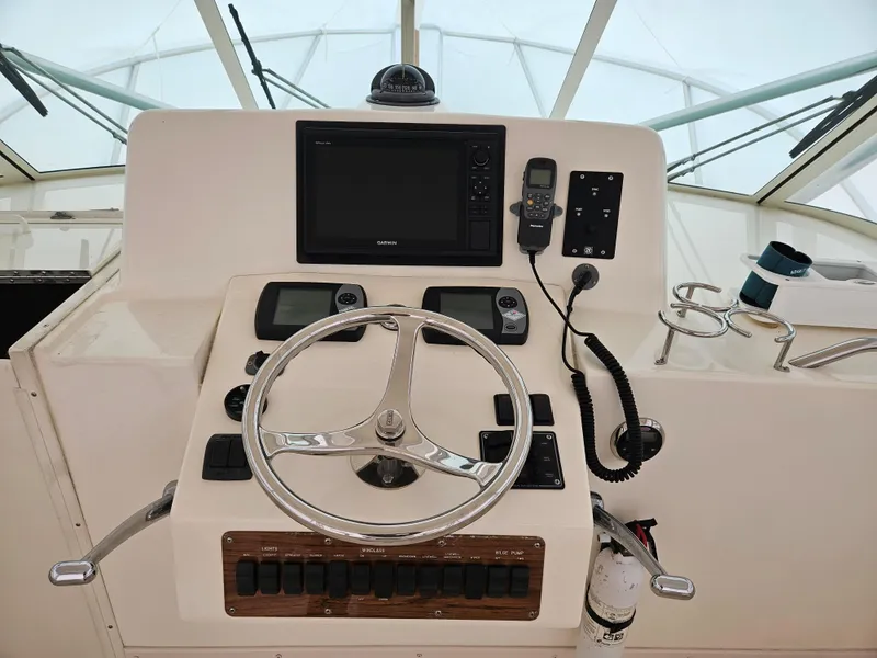 Slide: The Image of Helm of 2008 Albemarle 31 boat with steering wheel and navigation equipment. - 4