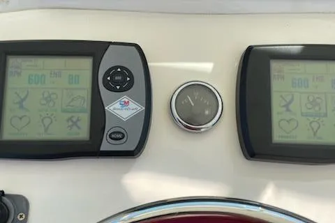 Slide: The Image of Control panel of a 2008 Albemarle 31 boat with digital displays and gauges. - 6