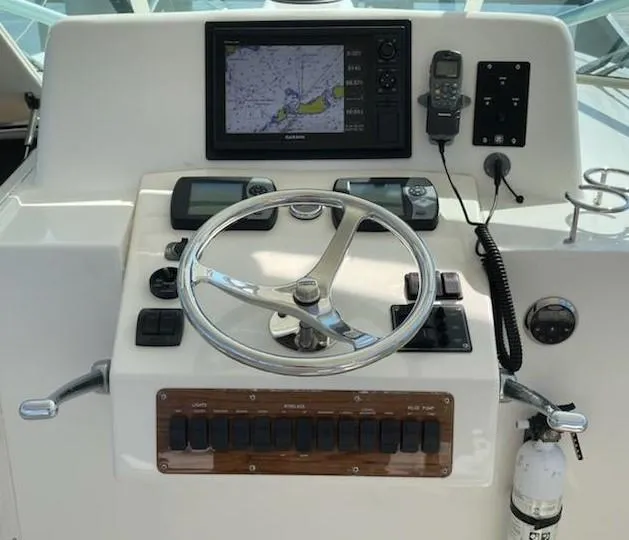 Slide: The Image of 2008 Albemarle 31 boat helm with navigation equipment and steering wheel. - 7