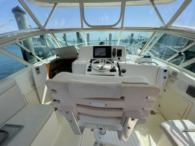 Slide: The Image of 2008 Albemarle 31 boat cockpit with steering wheel and navigation equipment. - 9