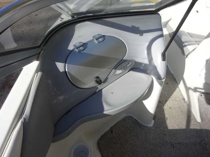 Slide: The Image of 2004 VIP 185 Vegas boat interior with storage compartment and seating. - 10