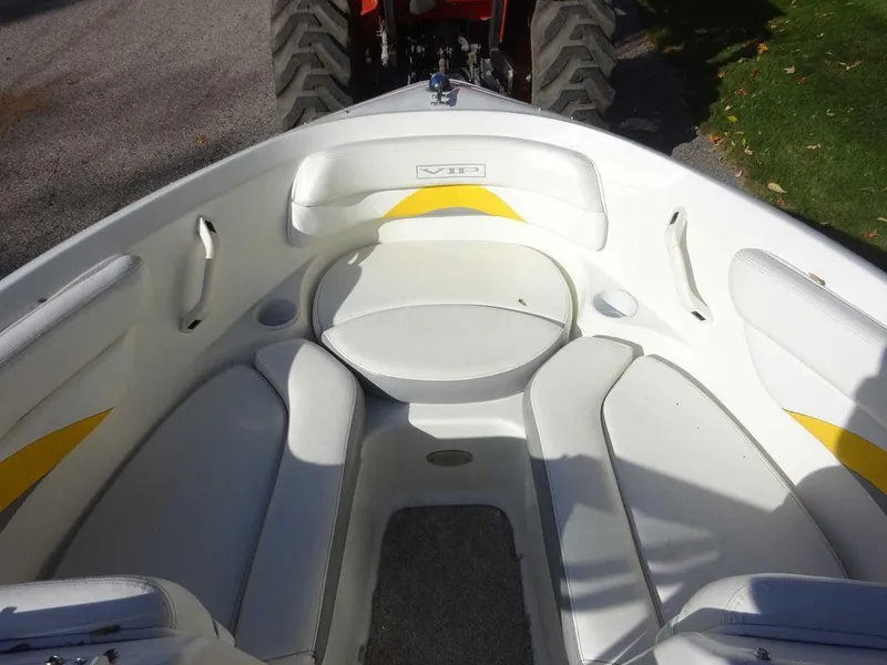 Slide: The Image of 2004 VIP 185 Vegas boat interior with white and yellow seating. - 2
