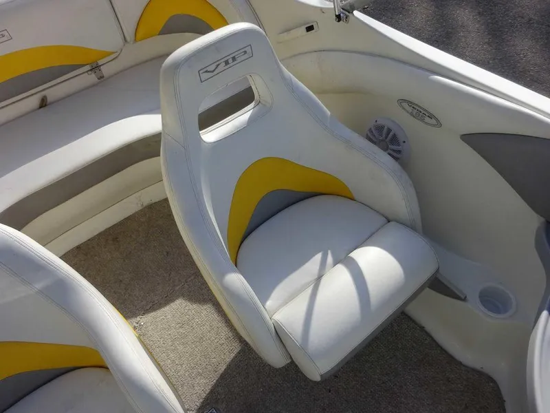Slide: The Image of 2004 VIP 185 Vegas boat interior with white and yellow seating. - 3
