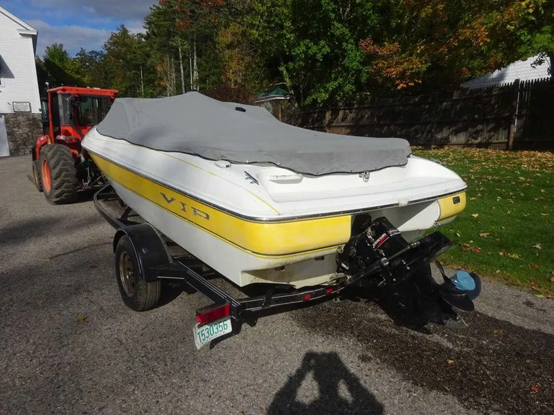 Slide: The Image of 2004 VIP 185 Vegas boat with cover on trailer, parked outdoors. - 5