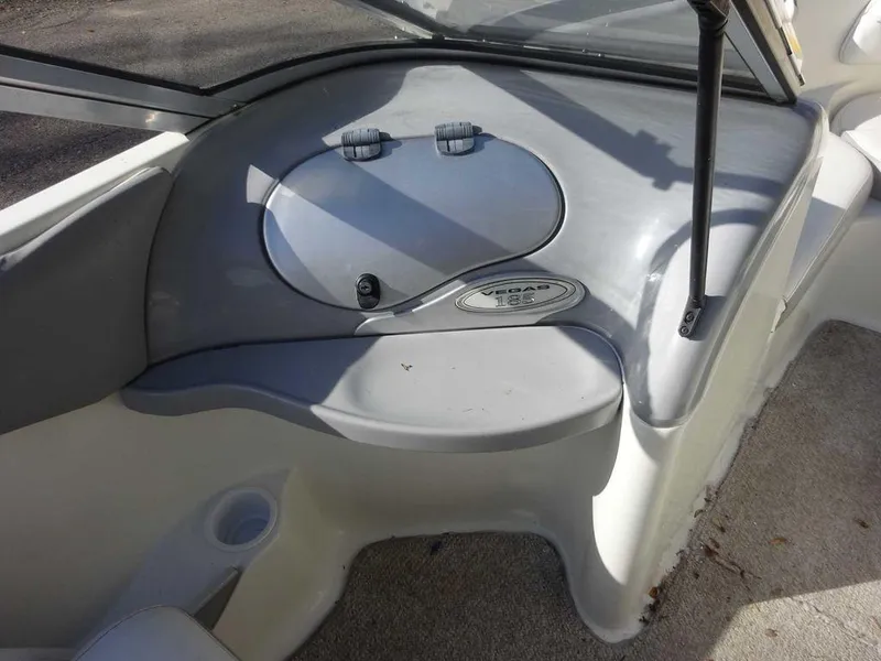 Slide: The Image of 2004 VIP 185 Vegas boat interior dashboard with storage compartment. - 8