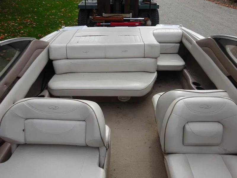 Slide: The Image of 2000 Regal 2100 LSR boat interior with white leather seats. - 19