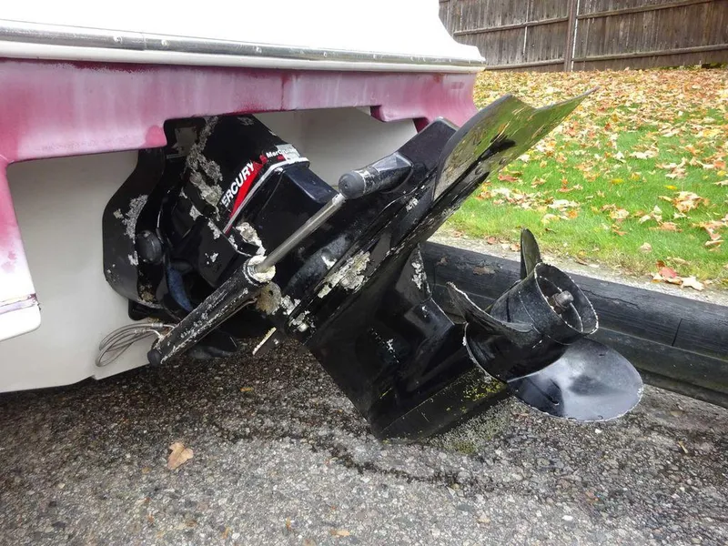 Slide: The Image of Close-up of a 2000 Regal 2100 LSR boat's damaged outboard motor. - 7