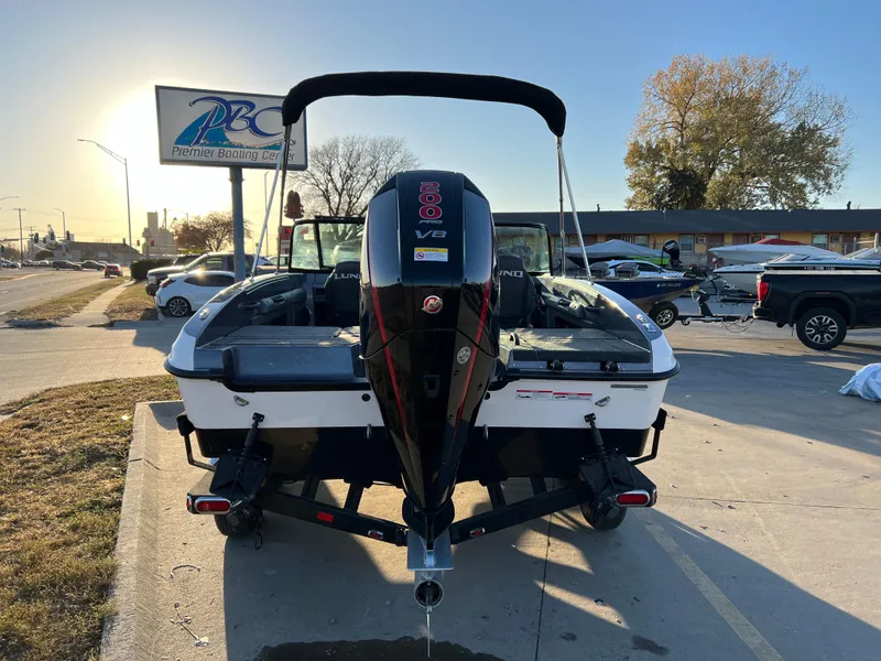 Slide: The Image of 2024 Lund 189 Tyee GL boat with outboard motor at dealership. - 2
