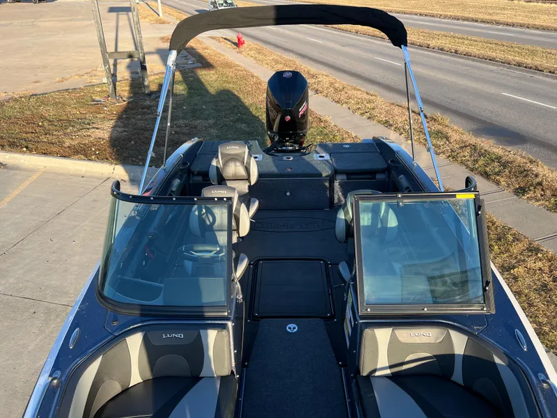 Slide: The Image of 2024 Lund 189 Tyee GL boat with open bow and windshield. - 3