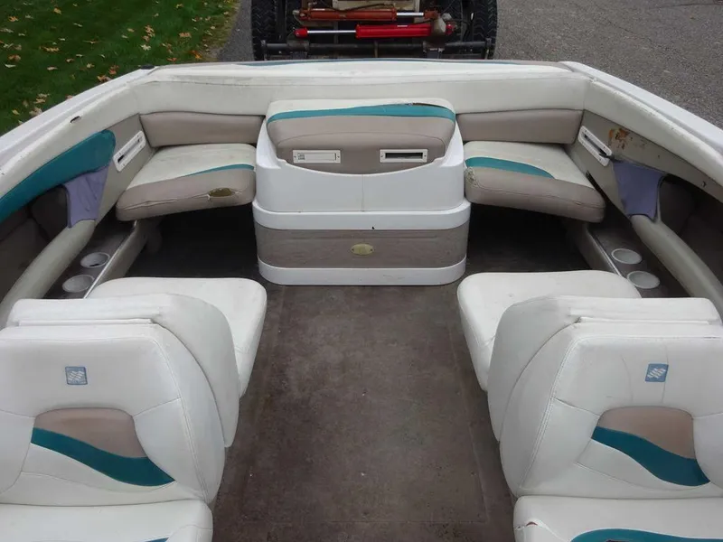 Slide: The Image of 1998 Four Winns 200 Horizon boat interior with white and teal seating. - 11