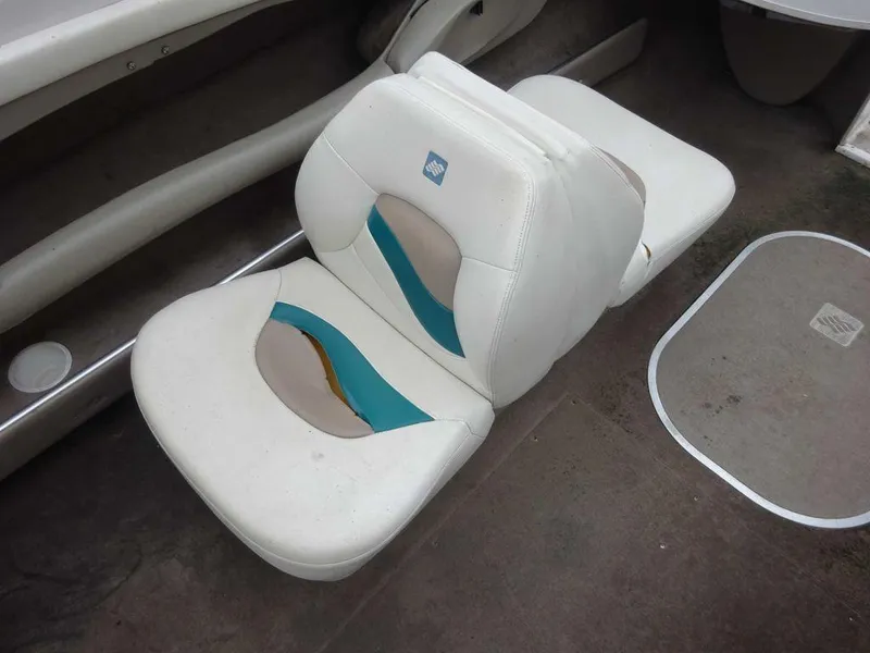 Slide: The Image of 1998 Four Winns 200 Horizon boat seats with white and teal upholstery. - 15