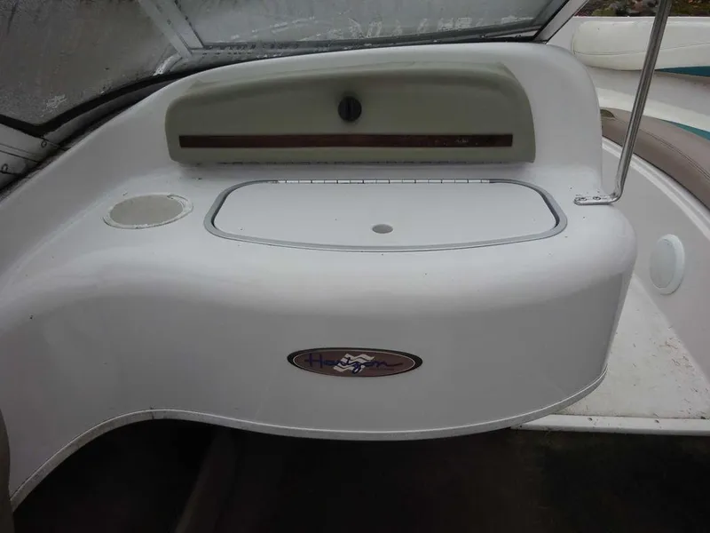 Slide: The Image of 1998 Four Winns 200 Horizon boat interior dashboard and storage compartment. - 16