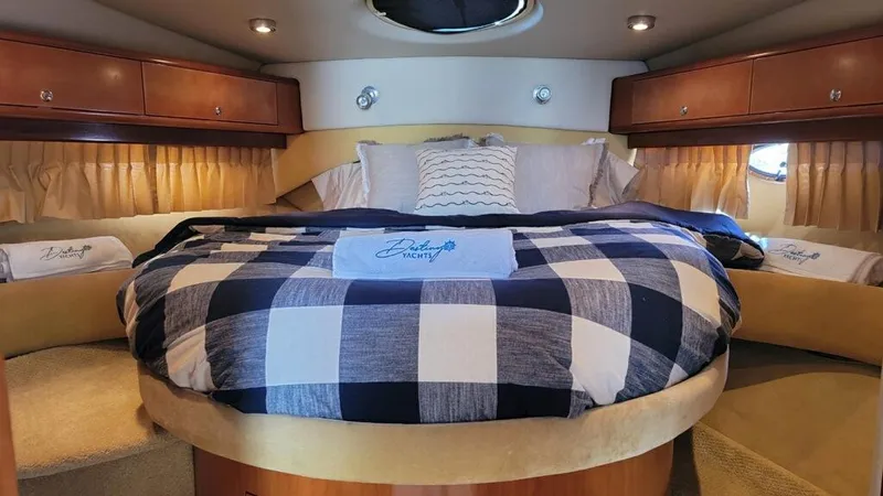 Slide: The Image of Luxurious bedroom in 2004 Regal 4260 Commodore yacht with cozy bedding. - 17