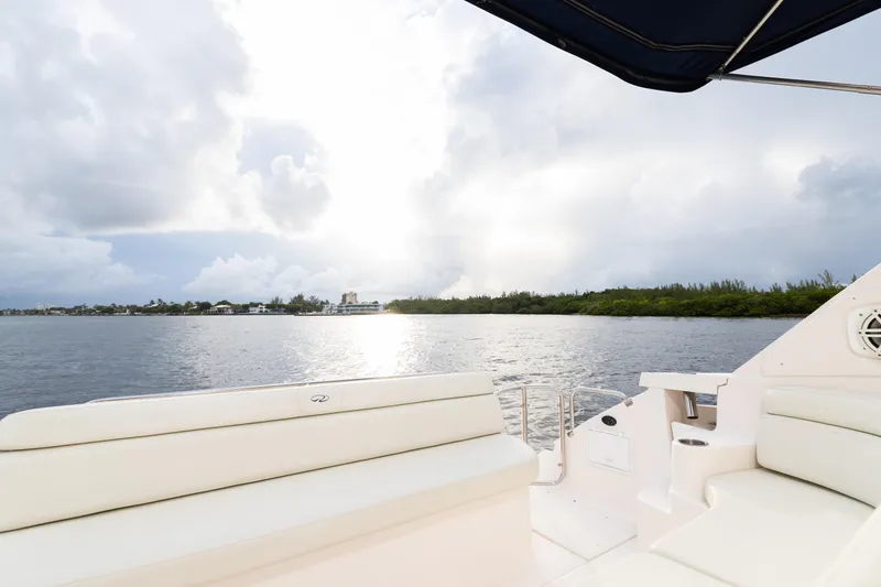 Slide: The Image of View from the deck of a 2004 Regal 4260 Commodore yacht on a serene waterway. - 6