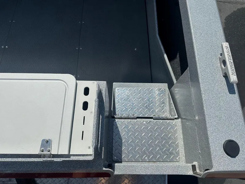 Slide: The Image of KingFisher 2025 Escape boat deck with metal hatch and textured flooring, 2024 model. - 15