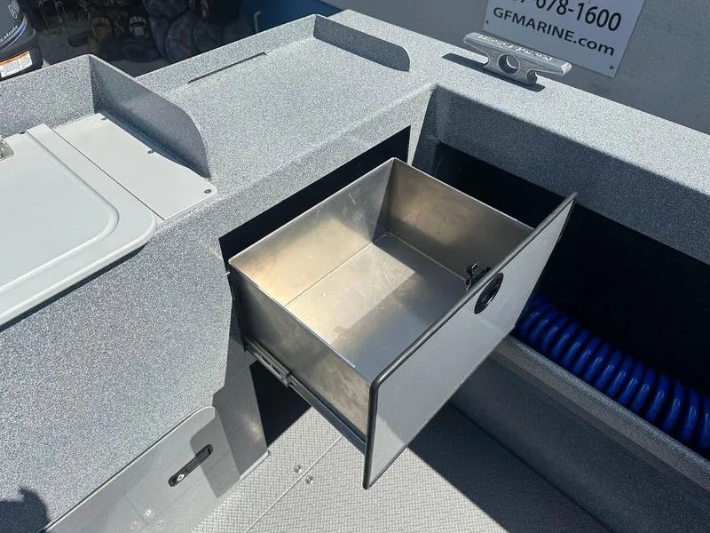 Slide: The Image of KingFisher 2025 Escape 2024 model boat with open storage compartment. - 19