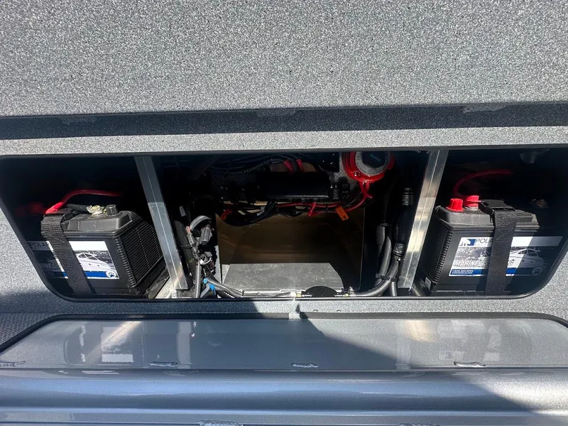 Slide: The Image of Battery compartment of 2024 KingFisher 2025 Escape boat, showing dual batteries and wiring. - 21