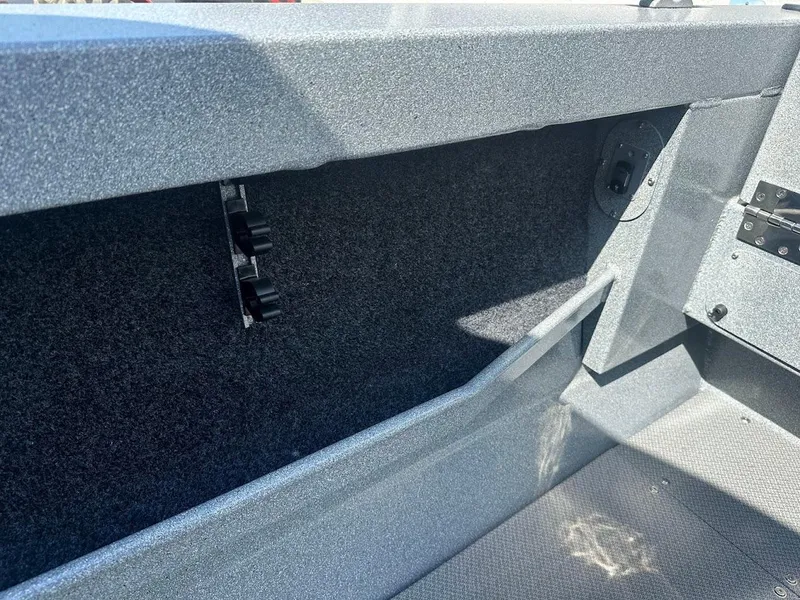 Slide: The Image of Interior view of 2024 KingFisher 2025 Escape boat, showcasing storage compartment details. - 23